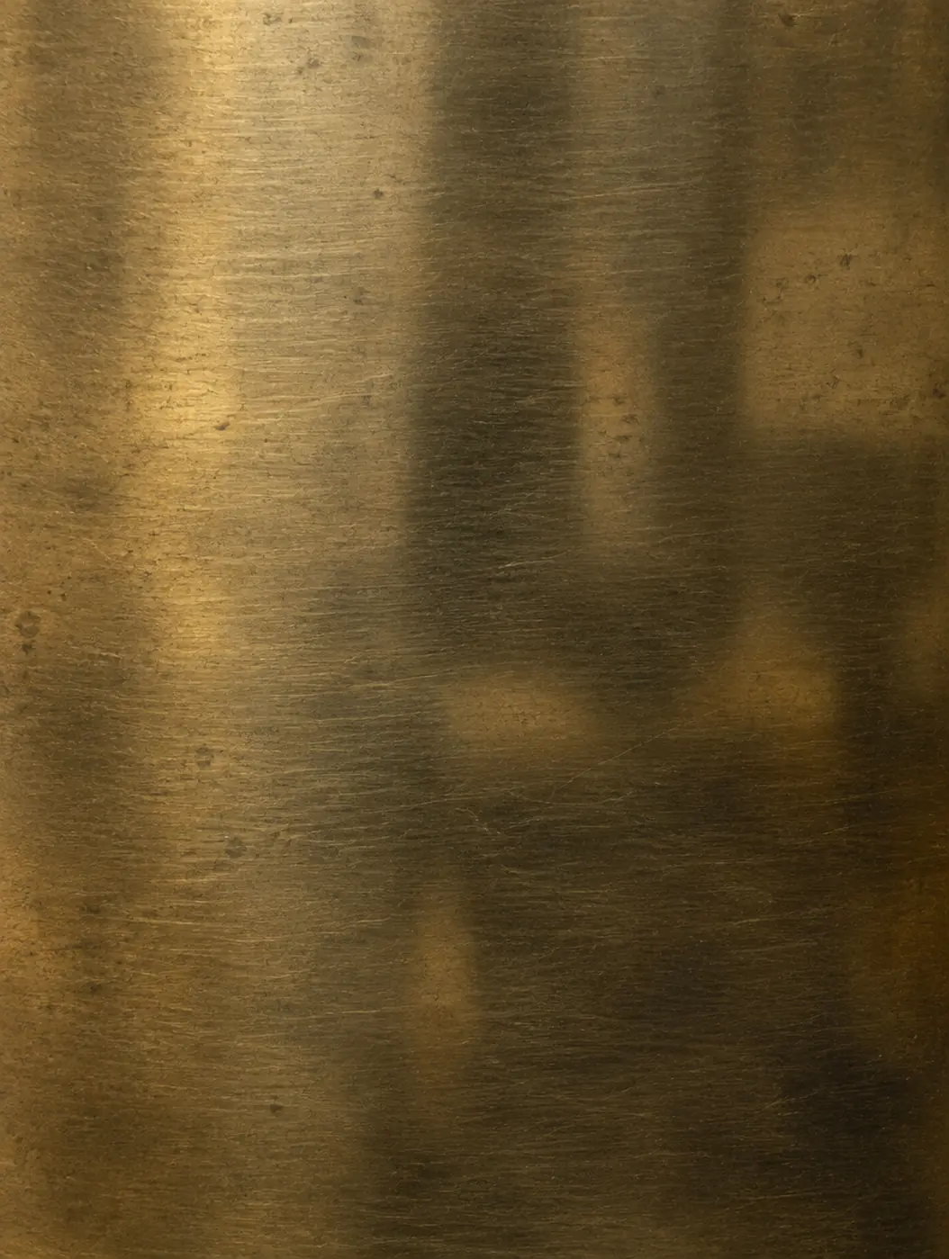 Hand-aged brass with a brushed grain.